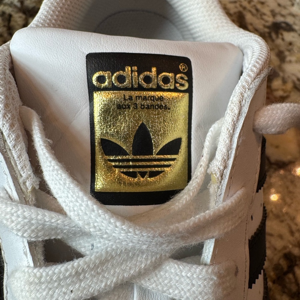 Adidas Superstar Sneakers in White and Black with Gold Accent